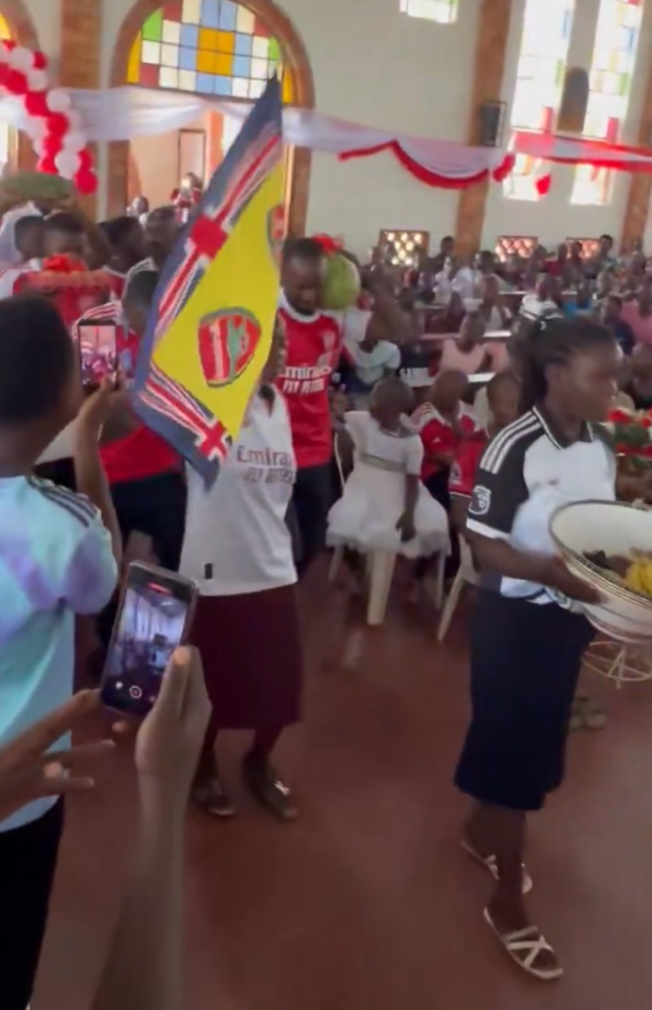 Arsenal fans church celebration Uganda